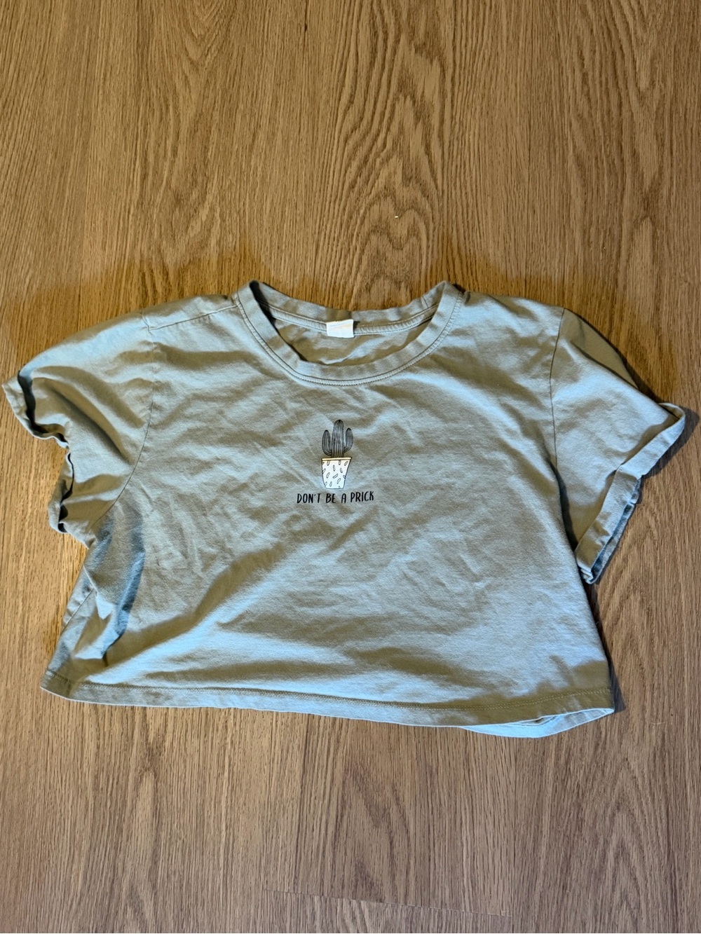 Women’s Sage Green Graphic Crop Tee - "Don't Be A Prick"